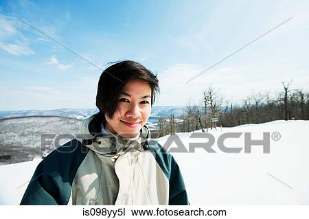 Woman wearing ski jacket, portrait View Large Photo Image Stock Image - Woman wearing ski jacket, portrait. Fotosearch