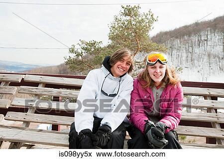Young couple wearing winter sports clothing, portrait View Large Photo Image Stock Photo - Young couple wearing winter sports clothing, portrait. Fotosearch