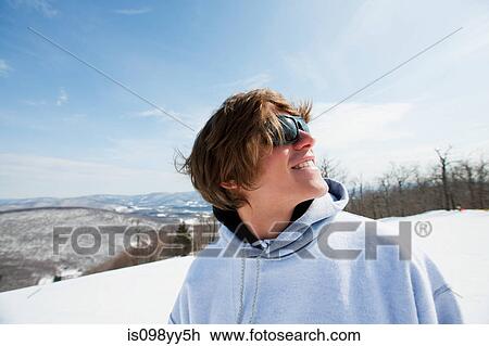 Young man wearing hooded top looking away View Large Photo Image Stock Image - Young man wearing hooded top looking away. Fotosearch