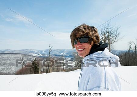 Young man wearing sunglasses and hooded top, portrait View Large Photo Image Stock Photography - Young man wearing sunglasses and hooded top, portrait. Fotosearch