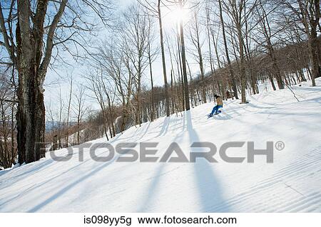 Young woman snowboarding View Large Photo Image Stock Image - Young woman snowboarding. Fotosearch
