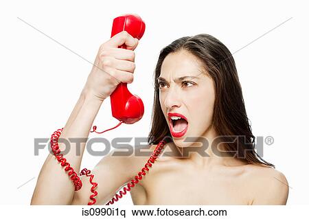 Angry woman shouting into red telephone View Large Photo Image Stock Photography - Angry woman shouting into red telephone. Fotosearch