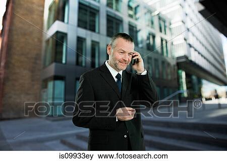 Businessman on cell phone View Large Photo Image Stock Photo - Businessman on cell phone. Fotosearch