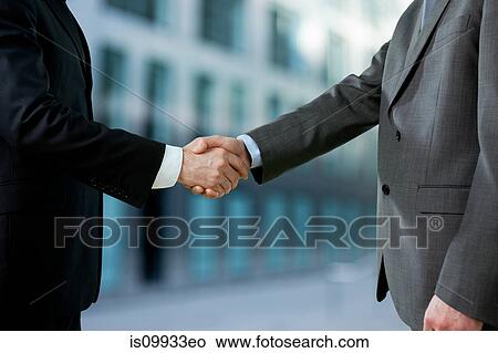 Businessmen shaking hands View Large Photo Image Picture - Businessmen shaking hands. Fotosearch
