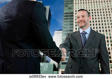 Stock Photo - Businessmen shaking hands. Fotosearch
