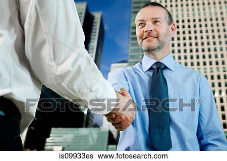 Stock Photograph - Businessmen shaking hands. Fotosearch