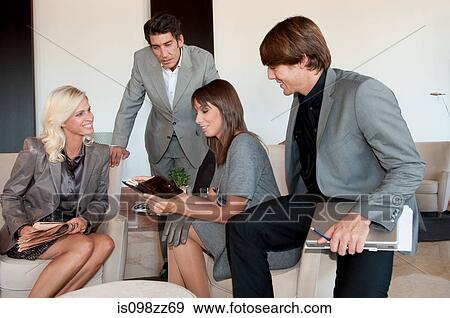 Businesspeople having informal meeting View Large Photo Image Stock Photo - Businesspeople having informal meeting. Fotosearch