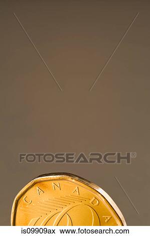 Stock Photo - Canadian dollar coin, close up. Fotosearch