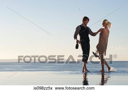 Stock Photo - Couple by the ocean. Fotosearch