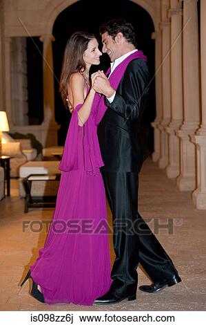 Stock Image - Elegant couple dancing together. Fotosearch