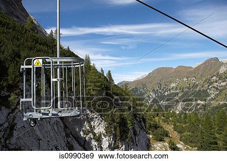 Empty chair lift, Marmolada mountains, Dolomites, Italy View Large Photo Image Stock Photo - Empty chair lift, Marmolada mountains, Dolomites, Italy. Fotosearch