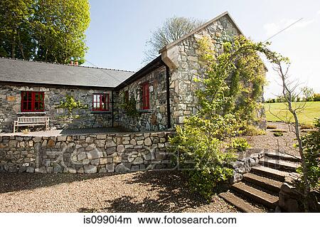 Picture - Exterior of rural Irish cottage. Fotosearch