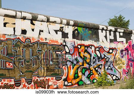 Stock Image - Graffiti on East Side Gallery of Berlin Wall, Berlin, Germany. Fotosearch