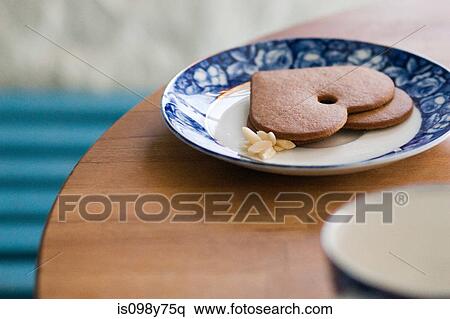 Heart shaped cookies on a plate View Large Photo Image Stock Photography - Heart shaped cookies on a plate. Fotosearch