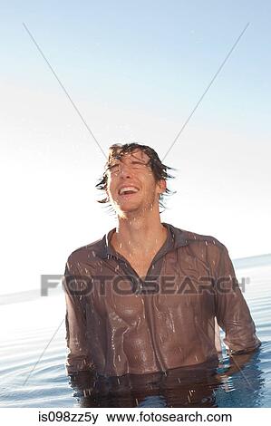 Man cooling off in the sea View Large Photo Image Stock Photo - Man cooling off in the sea. Fotosearch