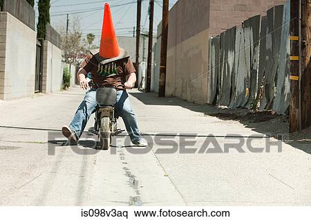 Man with traffic cone on head, riding motorbike View Large Photo Image Stock Photography - Man with traffic cone on head, riding motorbike. Fotosearch