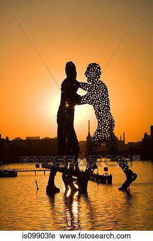 Stock Image - Molecule Man sculpture, Berlin, Germany. Fotosearch