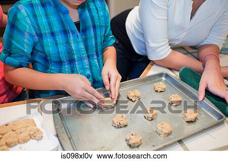 Mother and daughter baking cookies View Large Photo Image Stock Photo - Mother and daughter baking cookies. Fotosearch
