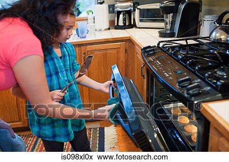 Mother and daughter baking cookies View Large Photo Image Stock Photo - Mother and daughter baking cookies. Fotosearch
