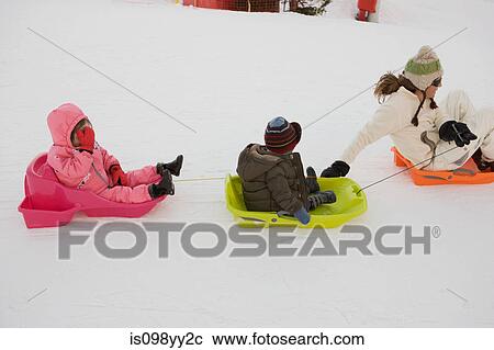 Mother pulling two children on sledges View Large Photo Image Stock Image - Mother pulling two children on sledges. Fotosearch