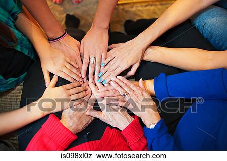 Multigenerational females touching hands View Large Photo Image Stock Photo - Multigenerational females touching hands. Fotosearch