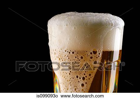 Overflowing glass of beer View Large Photo Image Picture - Overflowing glass of beer. Fotosearch
