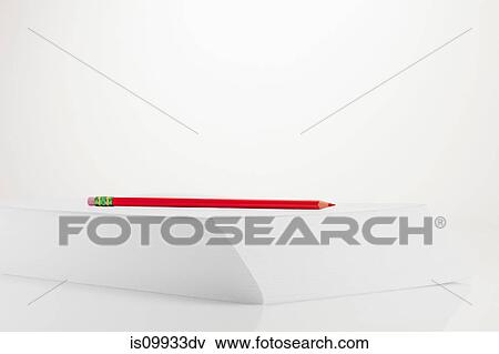 Pencil on stack of paper View Large Photo Image Stock Photo - Pencil on stack of paper. Fotosearch