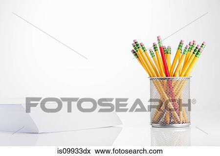 Pencils in pot and stack of paper View Large Photo Image Stock Photo - Pencils in pot and stack of paper. Fotosearch