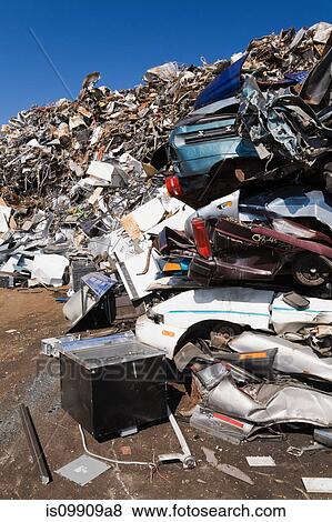 Pile of rusty cars at scrap yard View Large Photo Image Stock Photo - Pile of rusty cars at scrap yard. Fotosearch