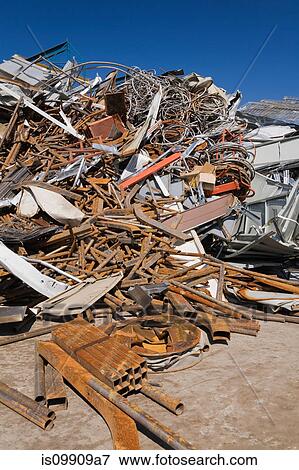 Stock Photo - Pile of rusty metal at scrap yard. Fotosearch