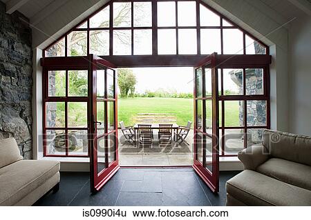 Room with doors open onto patio View Large Photo Image Stock Photograph - Room with doors open onto patio. Fotosearch