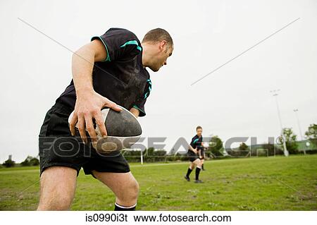 Rugby game in action View Large Photo Image Stock Photograph - Rugby game in action. Fotosearch