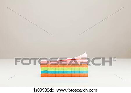 Stack of colored paper View Large Photo Image Stock Image - Stack of colored paper. Fotosearch