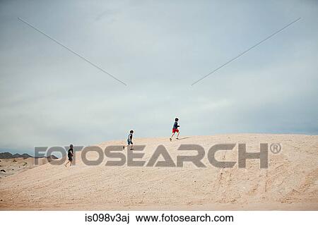 Three boys walking on hill View Large Photo Image Stock Image - Three boys walking on hill. Fotosearch