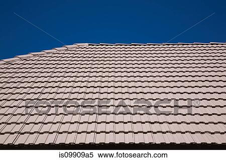 Stock Photography - Tiled roof against blue sky. Fotosearch