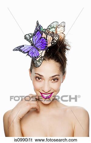 Woman wearing butterfly hair accessory View Large Photo Image Stock Photograph - Woman wearing butterfly hair accessory. Fotosearch
