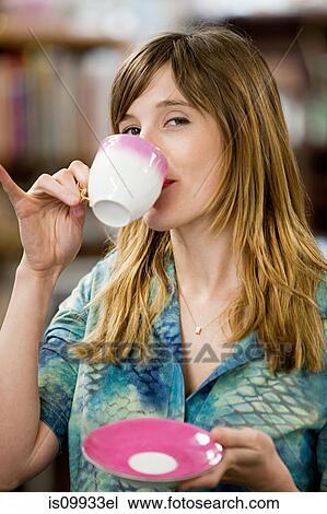 Woman with cup and saucer, portrait View Large Photo Image Stock Image - Woman with cup and saucer, portrait. Fotosearch