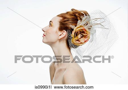 Woman with flower hair accessory View Large Photo Image Stock Image - Woman with flower hair accessory. Fotosearch
