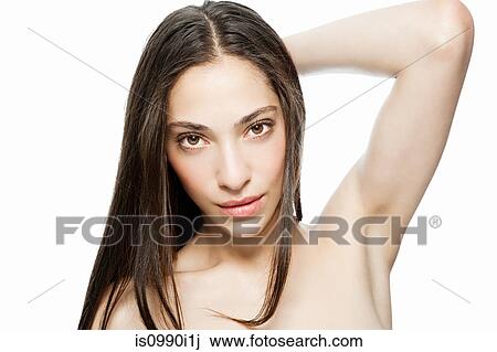 Woman with hand in hair, portrait View Large Photo Image Stock Image - Woman with hand in hair, portrait. Fotosearch