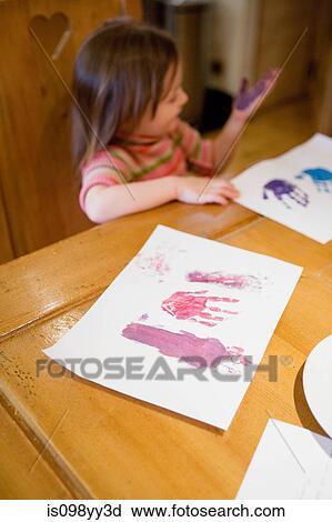 Young girl finger painting View Large Photo Image Stock Image - Young girl finger painting. Fotosearch