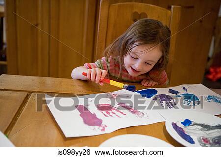 Young girl painting pictures View Large Photo Image Stock Photograph - Young girl painting pictures. Fotosearch
