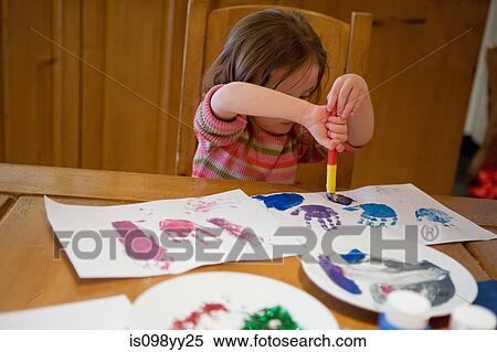 Young girl painting pictures View Large Photo Image Stock Photography - Young girl painting pictures. Fotosearch