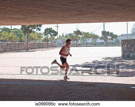 Stock Image - Young man running. Fotosearch