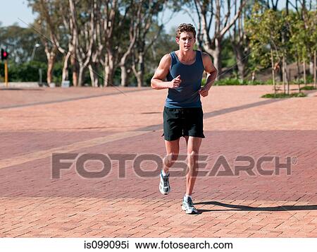 Stock Image - Young man running. Fotosearch
