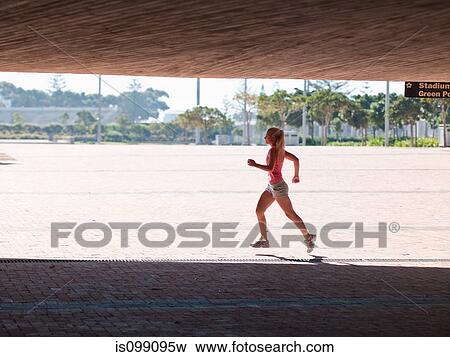 Young woman running View Large Photo Image Stock Photo - Young woman running. Fotosearch