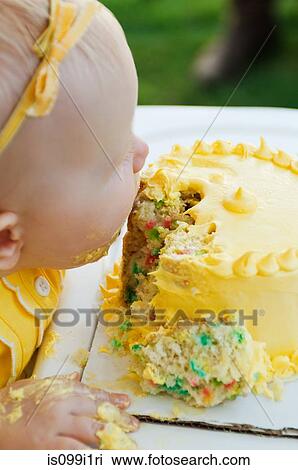 Baby eating a cake View Large Photo Image Stock Image - Baby eating a cake. Fotosearch