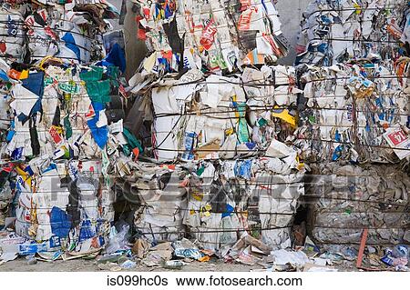 Stock Photograph - Bales of recyclable materials at a sorting centre. Fotosearch