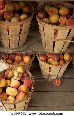 Baskets of ripe peaches View Large Photo Image Stock Photo - Baskets of ripe peaches. Fotosearch