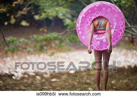 Girl with inflatable ring View Large Photo Image Stock Image - Girl with inflatable ring. Fotosearch