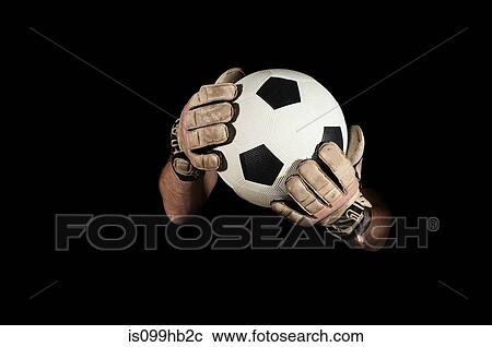 Stock Image - Goalkeeper holding football. Fotosearch